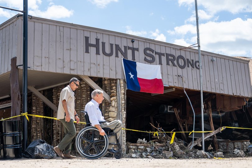 State Governor Greg Abbott arrives at a news conference in Hunt, Texas.