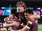 Cameron Munster (c), who lost his father days earlier, led the Maroons to a stirring victory. (Dan Himbrechts/AAP PHOTOS)