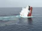 A screen grab taken from a handout video released by the Houthis military media center on 09 July 2025 shows the Liberian-flagged bulker, Eternity C, sinking after being attacked in the Red Sea.