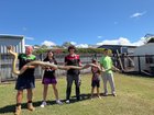 Jay Everding and his children show off the 5.2m python. 