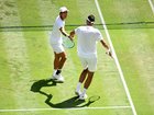 Rinky Hijikata of Australia celebrates with David Pel of Netherlands against Marcelo Arevalo of El Salvador and Mate Pavic.