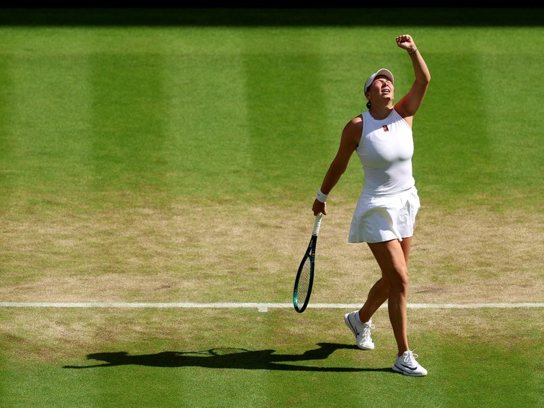 Amanda Anisimova of United States celebrates against Aryna Sabalenka.