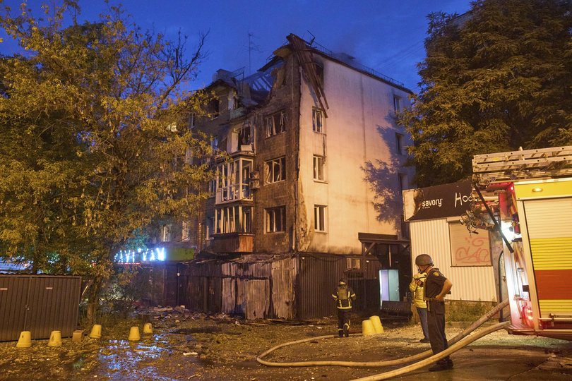Firefighters work in a destroyed apartment building after a Russian attack in Kyiv, Ukraine, early Thursday, July 10, 2025. (AP Photo/Efrem Lukatsky)