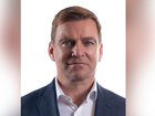 Commonwealth Bank executive Christopher James McCann has been extradited to Queensland, accused of arranging for a girl under 16 to attend a Brisbane hotel for sex.
