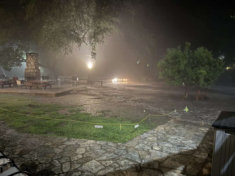 Floodwaters from the Guadalupe race outside the River Inn in Hunt, Texas, in the early hours of July 4, 2025.