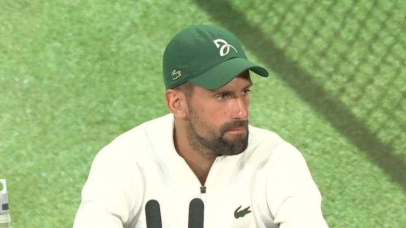 Novak Djokovic faces the media after losing to Sinner in straight sets.