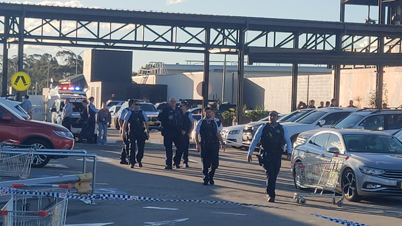 Police remain at the scene following the shooting.