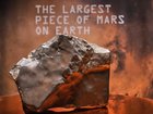 The largest piece of Mars ever found on earth is going under the hammer. (AP PHOTO)