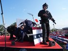 Secret Service agents cover Republican presidential nominee Donald Trump after shots were fired during a campaign rally on July 13, 2024, in Butler, Pennsylvania. MUST CREDIT: Jabin Botsford/The Washington Post