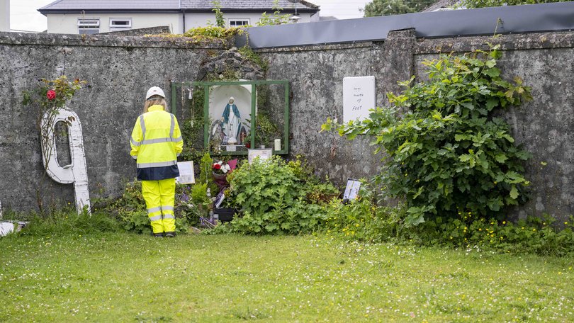 Handout photo issued by The Office of the Director of Authorised Intervention of a worker at the site of the former Mother and Baby institution in Tuam near Galway,