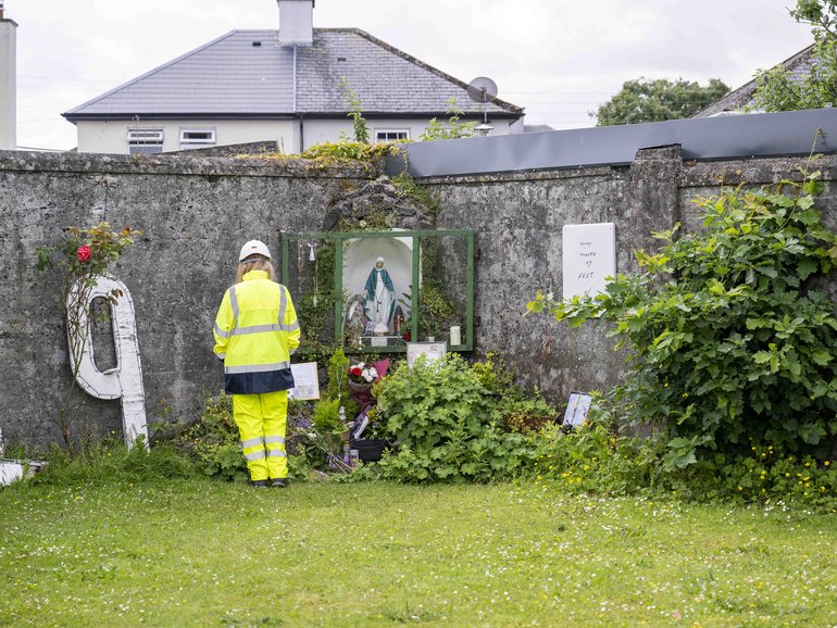 Handout photo issued by The Office of the Director of Authorised Intervention of a worker at the site of the former Mother and Baby institution in Tuam near Galway,