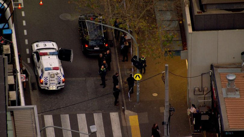 A man has been charged over a stabbing outside a Melbourne shopping precinct.