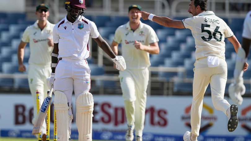 Australia's Mitchell Starc celebrates taking the wicket of West Indies' Jayden Seales.