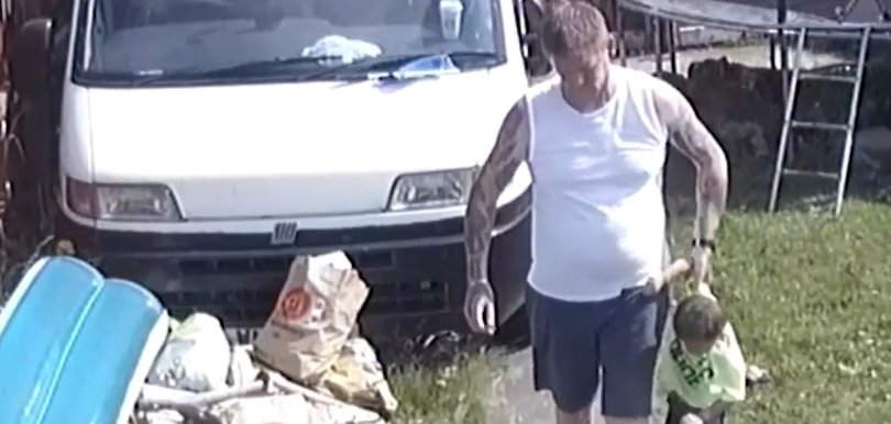 One clip shows the toddler’s grandfather yanking him off a trampoline and dragging him by pulling at just one of his arms.