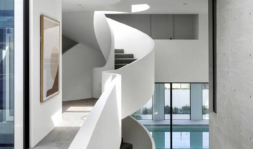 The staircase is drenched in natural light.
