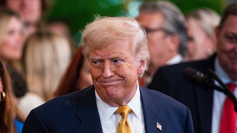 Trump greets attendees during a bill signing ceremony in the East Room on Wednesday, July 16, 2025.