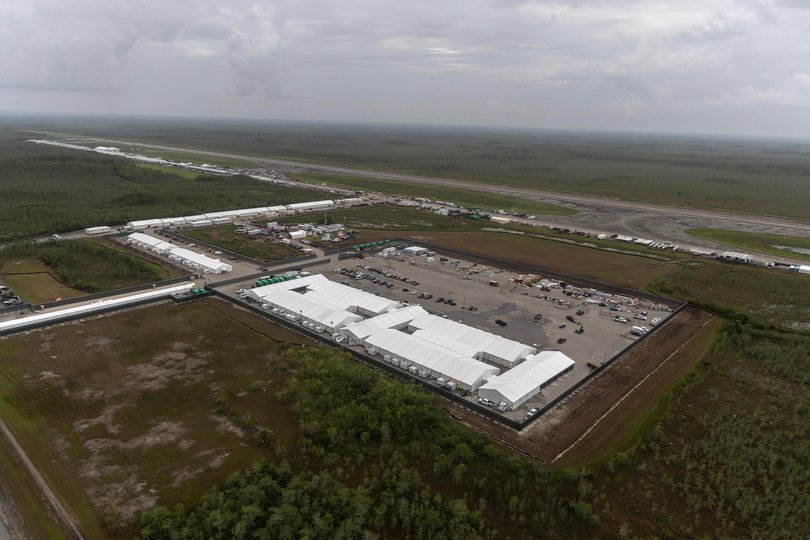 An aerial view of the 5000-bed facility, located at an abandoned airfield in the Everglades wetlands.