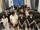 Alleged online scammers are paraded by Cambodian police in the southern city of Sihanoukville. (AP PHOTO)