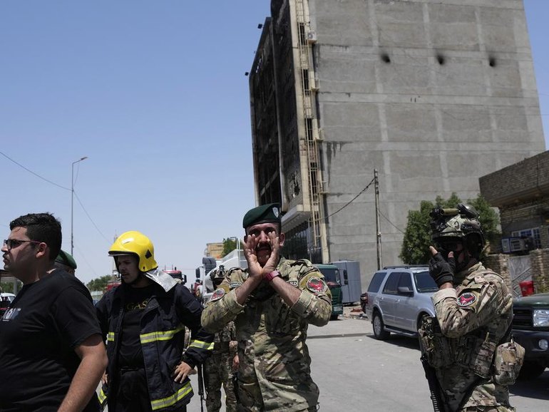 A fire at a newly opened shopping centre in eastern Iraq has killed more than 60 people, including women and children, Iraqi officials say.