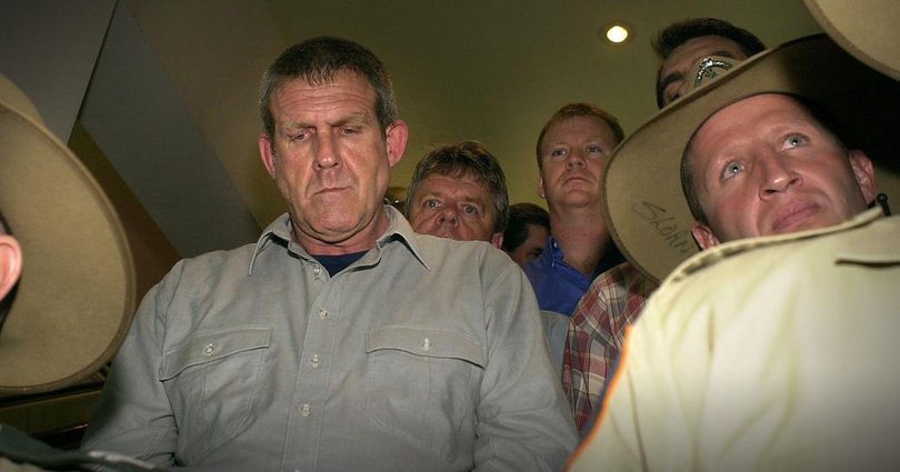 Murdoch arrives under police escort at Darwin Airport to face murder charges of British backpacker Peter Falconio.