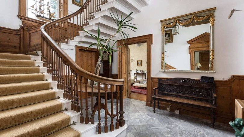 The oak-balustered staircase.