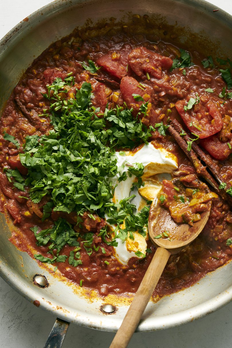 A tomato curry with crispy and creamy paneer from chef Anita Jaisinghani. Chunks of the cheese are roasted while a warmly spiced curry simmers away on the stove. Food Stylist: Simon Andrews. (David Malosh/The New York Times)