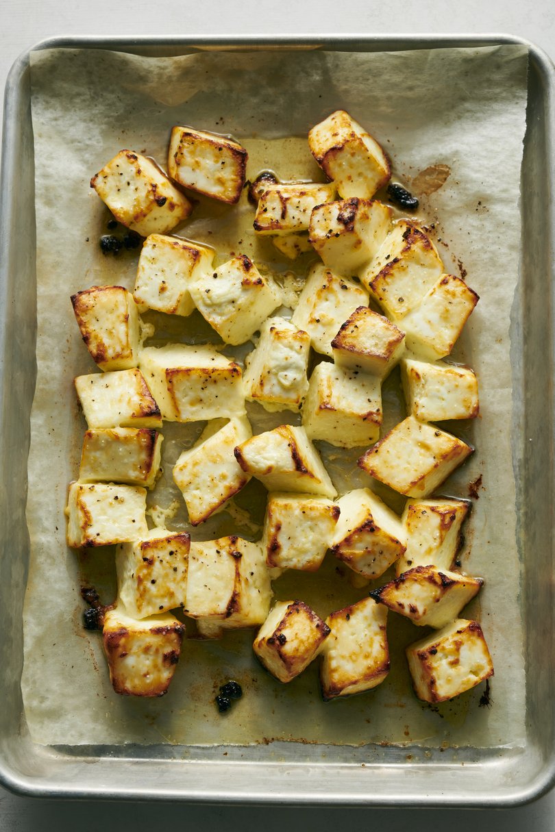 Crispy paneer for a tomato curry from chef Anita Jaisinghani. Chunks of the cheese are roasted while a warmly spiced curry simmers away on the stove. Food Stylist: Simon Andrews. (David Malosh/The New York Times)