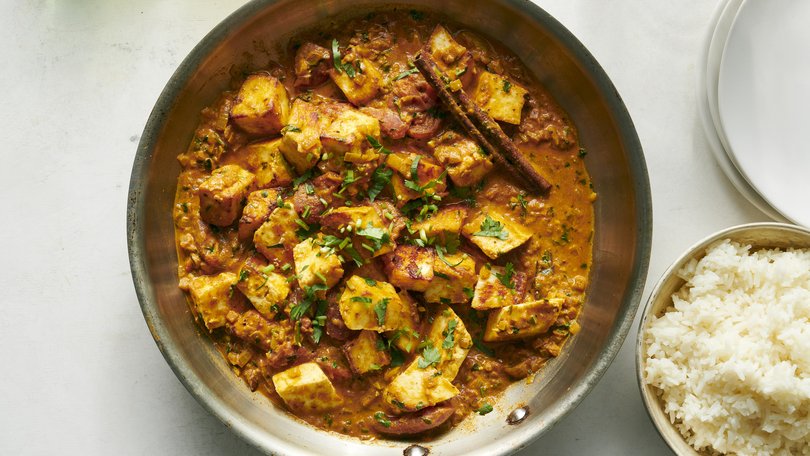 A tomato curry with crispy and creamy paneer from chef Anita Jaisinghani. Chunks of the cheese are roasted while a warmly spiced curry simmers away on the stove. Food Stylist: Simon Andrews. (David Malosh/The New York Times)