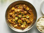 A tomato curry with crispy and creamy paneer from chef Anita Jaisinghani. Chunks of the cheese are roasted while a warmly spiced curry simmers away on the stove. Food Stylist: Simon Andrews. (David Malosh/The New York Times)