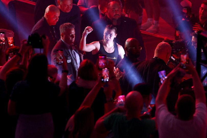 Katie Taylor acknowledges fans after defeating Amanda Serrano for the Undisputed Super Lightweight Title.