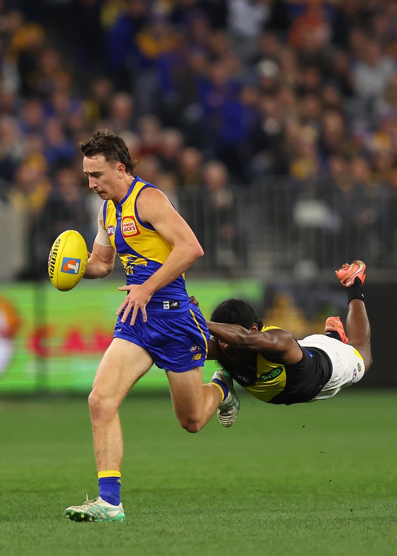 PERTH, AUSTRALIA - JULY 19: Maurice Rioli of the Tigers tackles Brady Hough of the Eagles during the round 19 AFL match between West Coast Eagles and Richmond Tigers at Optus Stadium on July 19, 2025 in Perth, Australia. (Photo by Paul Kane/Getty Images via AFL Photos)