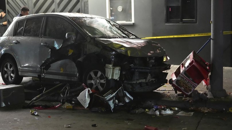 Police say a line of people were waiting to enter a nightclub when they were struck by a car.