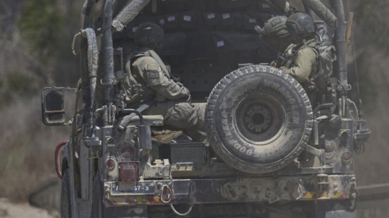 The Israel army says it fired warning shots at suspects  who approached its troops and did not stop.