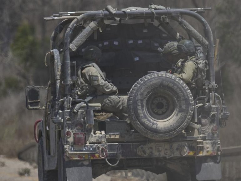 The Israel army says it fired warning shots at suspects  who approached its troops and did not stop.