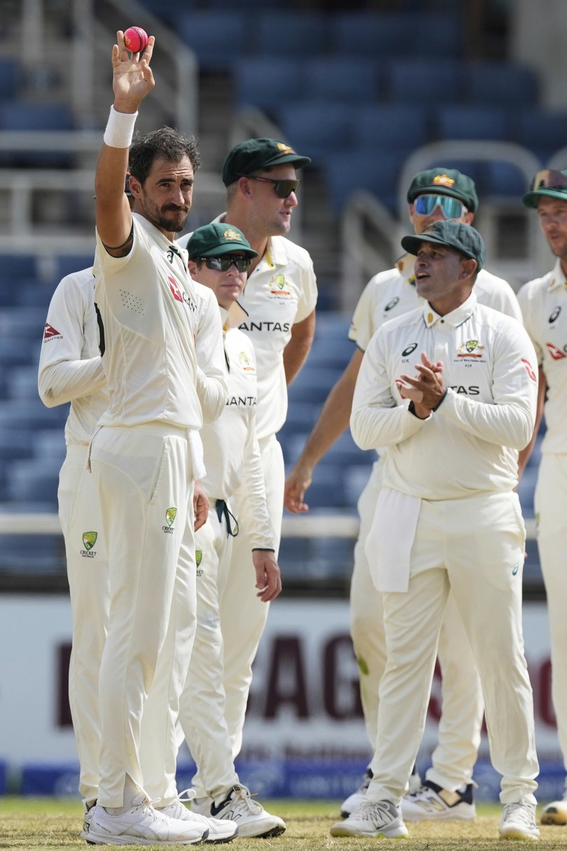 Mitchell Starc celebrates his 400th Test wicket.