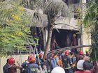 Firemen assess the wreckage of a Bangladesh Air Force training aircraft that crashed in Dhaka. 