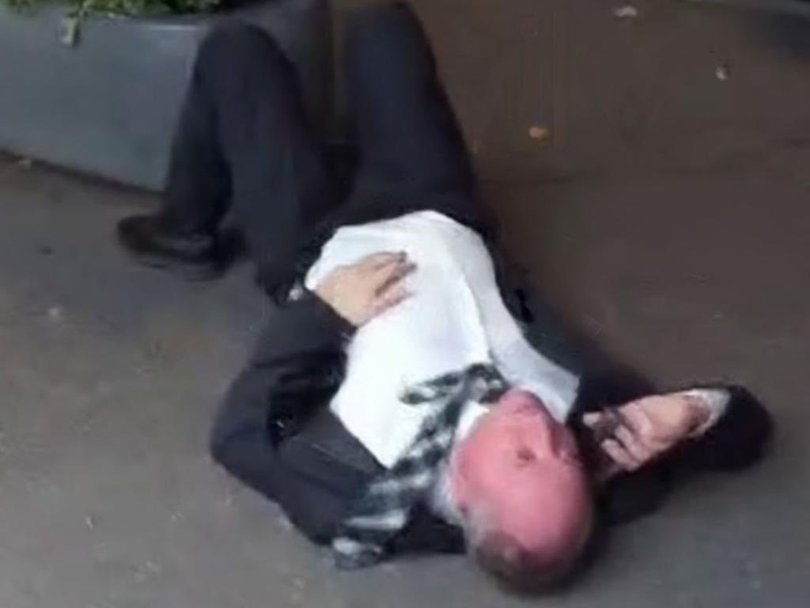 Barnaby Joyce is seen lying on the side of the road in Braddon, Canberra.