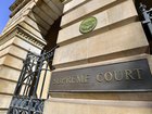 A retrial judge has found four men guilty of murdering a refugee during a drug robbery.