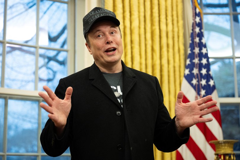 Elon Musk speaks in the Oval Office of the White House in Washington, DC, on February 11, 2025. Tech billionaire Elon Musk, who has been tapped by President Donald Trump to lead federal cost-cutting efforts, said the United States would go "bankrupt" without budget cuts. Musk leads the efforts under the newly created Department of Government Efficiency (DOGE), and was speaking at the White House with Trump, who has in recent weeks unleashed a flurry of orders aimed at slashing federal spending. (Photo by Jim WATSON / AFP)