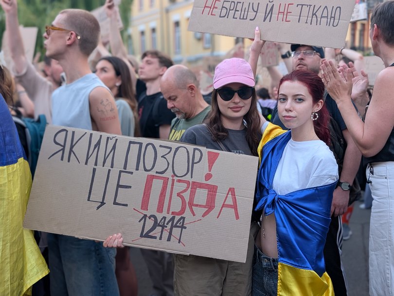 Ukrainian protestors, Ira (left) and Vlada (right) attend a demonstration against President Volodymyr Zelensky in Kyiv on Wednesday, 23 July, 2025.