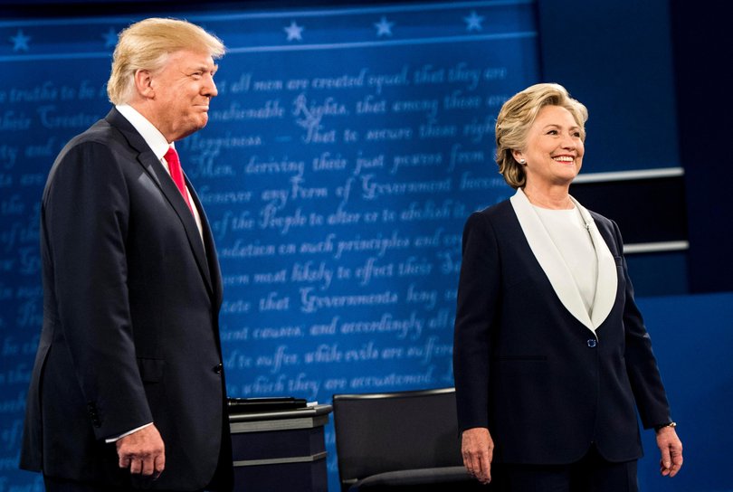 Hillary Clinton and Donald Trump stand onstage for a presidential debate in 2016.