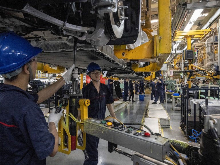 FILE — Workers on a production line at an electric-vehicle factory in Chongqing, China, May 20, 2025. European Union officials are set for a summit with China’s top leaders. China’s support of Russia and a long list of trade disputes are on the agenda.(Gilles Sabrié/The New York Times)