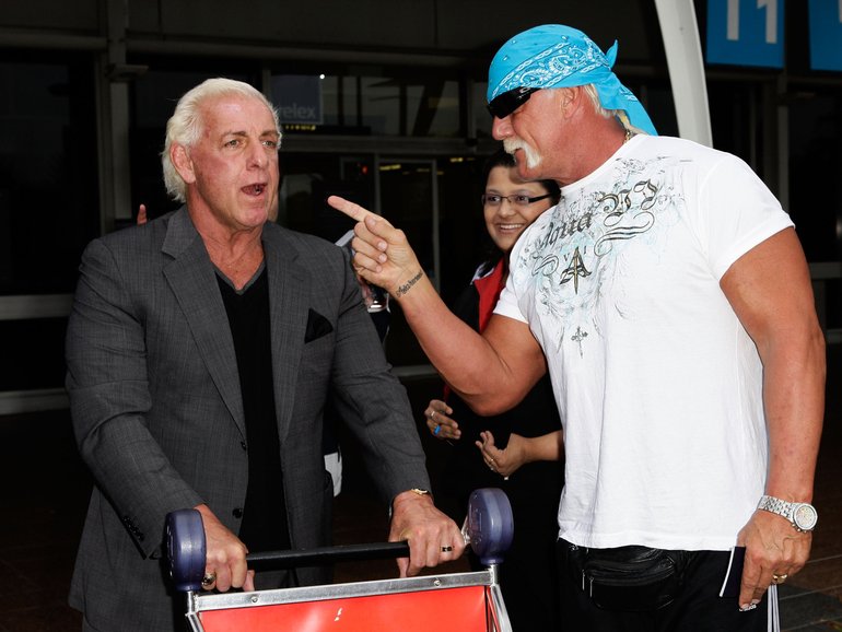 Hulk Hogan (R) and Ric Flair arrive at Sydney Airportin 2009.