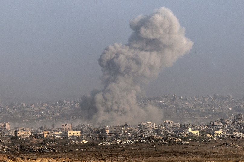 An Israeli airstrike is seen over northern Gaza in the early morning on Tuesday.