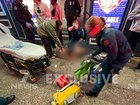 Paramedics at the scene treating the man.