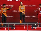 Oscar Piastri  is flanked on the rostrum by Lando Norris (left)  and Ferrari's Charles Leclerc.  (AP PHOTO)