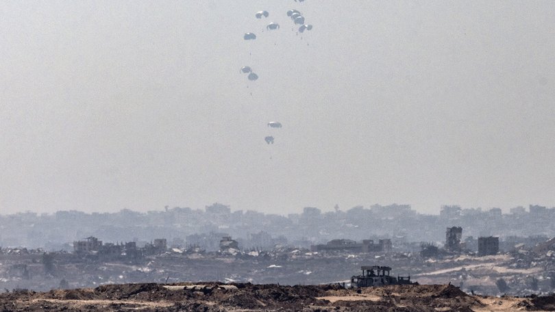 Humanitarian aid is airdropped over Gaza City on Sunday. Israel allowed Jordan and the United Arab Emirates to parachute aid into the enclave.