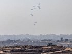 Humanitarian aid is airdropped over Gaza City on Sunday. Israel allowed Jordan and the United Arab Emirates to parachute aid into the enclave. 
