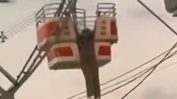 A Brazilian woman has miraculously walked away unharmed after almost plunging to her death at a local carnival.