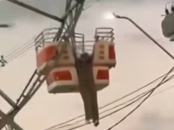 A Brazilian woman has miraculously walked away unharmed after almost plunging to her death at a local carnival.